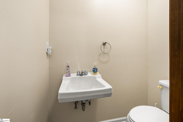 bathroom with toilet and sink