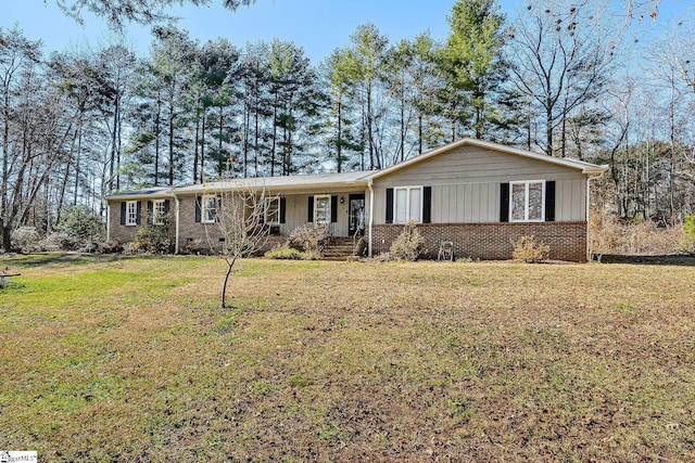 ranch-style house with a front lawn and a porch