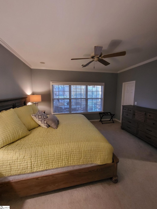 unfurnished bedroom featuring carpet, ceiling fan, and crown molding