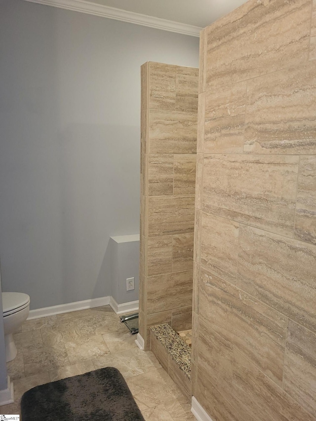 bathroom featuring toilet and ornamental molding