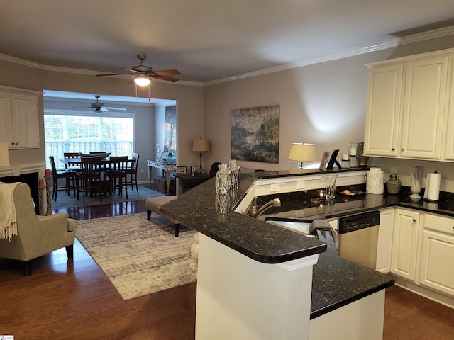 kitchen featuring white cabinets, stainless steel dishwasher, ceiling fan, dark hardwood / wood-style floors, and kitchen peninsula