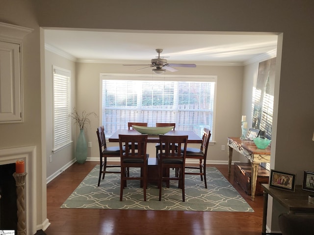 dining space featuring dark hardwood / wood-style flooring, plenty of natural light, ornamental molding, and ceiling fan