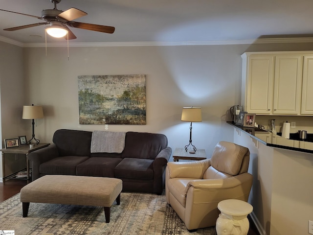 living room featuring ceiling fan, hardwood / wood-style flooring, and ornamental molding