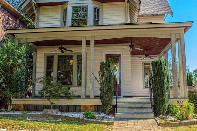 doorway to property featuring ceiling fan