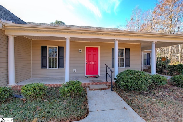 property entrance with covered porch