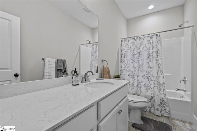 full bathroom with shower / bath combination with curtain, vanity, and toilet