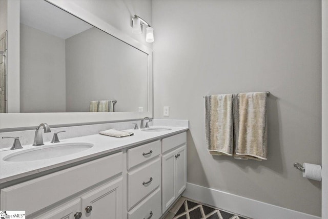 bathroom featuring tile patterned flooring and vanity