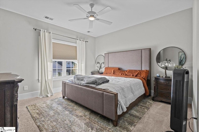 bedroom with ceiling fan and light colored carpet