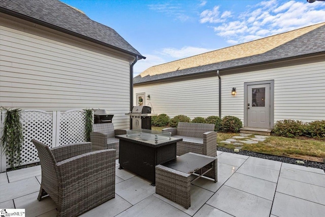 view of patio with area for grilling and an outdoor living space