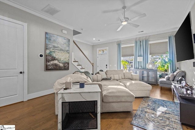 living room featuring ceiling fan, dark hardwood / wood-style floors, and ornamental molding