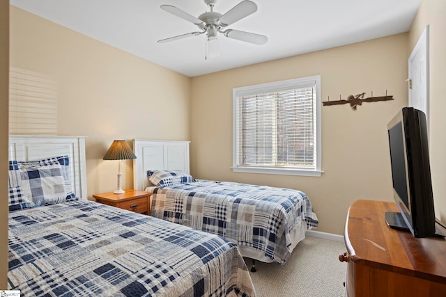 bedroom with ceiling fan and carpet floors