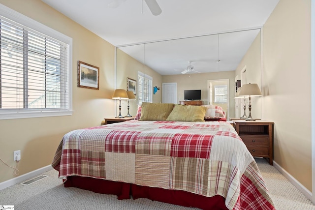 carpeted bedroom featuring ceiling fan