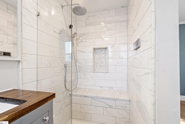 bathroom featuring sink and tiled shower