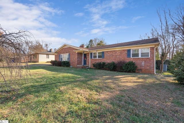 ranch-style house featuring a front lawn