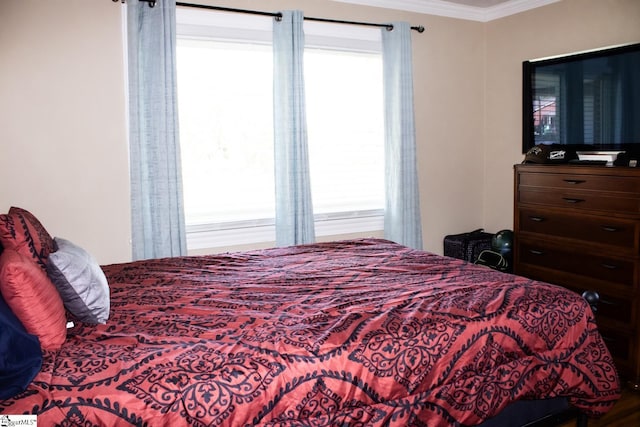 bedroom with ornamental molding