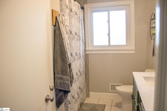 bathroom featuring tile patterned flooring, vanity, a shower with shower curtain, and toilet