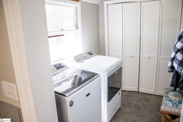 laundry room featuring cabinets and washing machine and clothes dryer