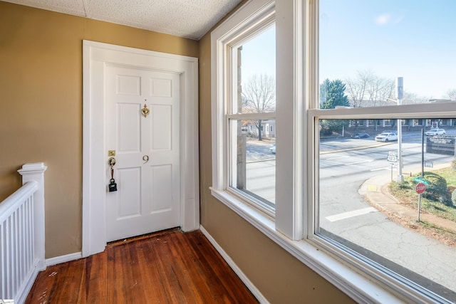 doorway to outside featuring dark hardwood / wood-style floors