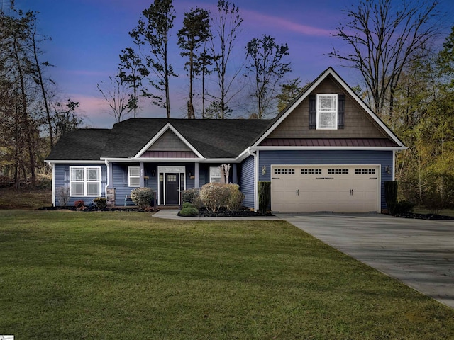 craftsman-style home with a lawn and a garage