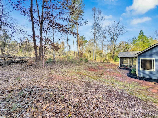 view of yard with a sunroom