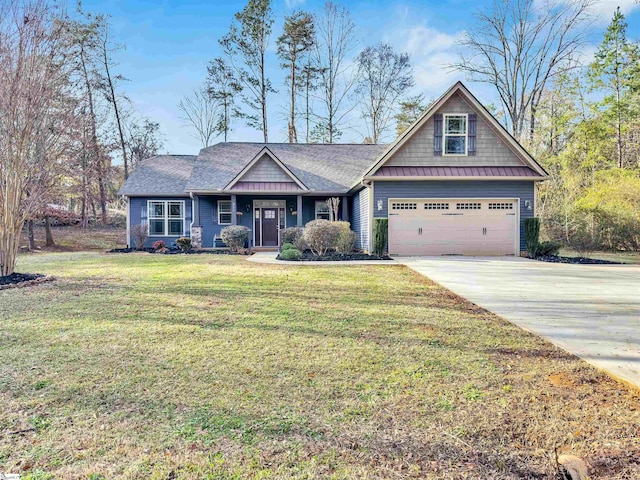 craftsman house with a front lawn and a garage