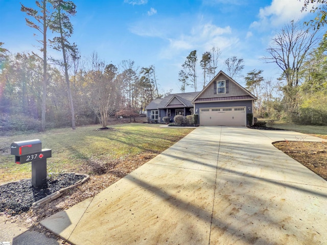 view of front of home with a garage and a front lawn