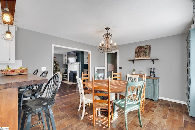 dining area with an inviting chandelier