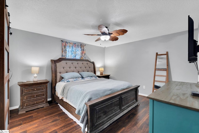 bedroom featuring a textured ceiling, dark hardwood / wood-style floors, and ceiling fan