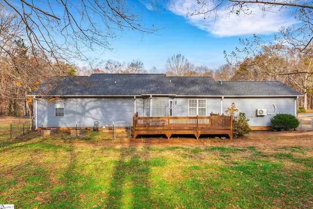 back of house with a yard and a deck