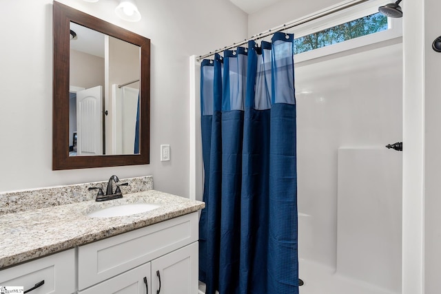 bathroom featuring vanity and walk in shower