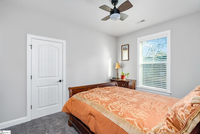 carpeted bedroom with ceiling fan