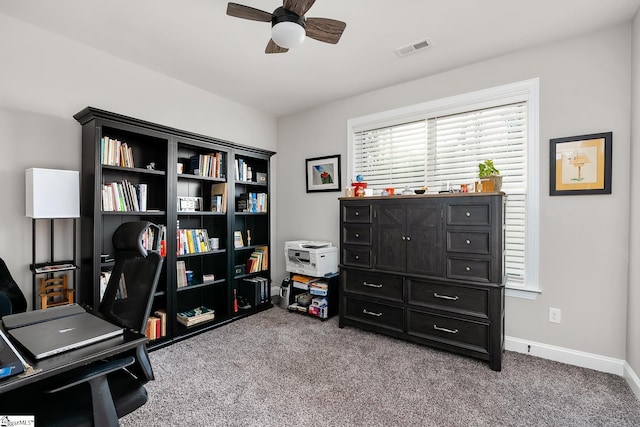 carpeted office featuring ceiling fan