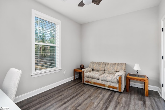 sitting room featuring ceiling fan and dark hardwood / wood-style flooring