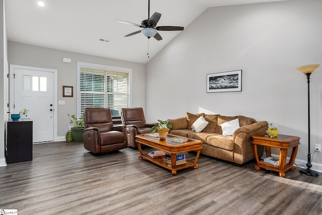 living room featuring hardwood / wood-style floors, vaulted ceiling, and ceiling fan