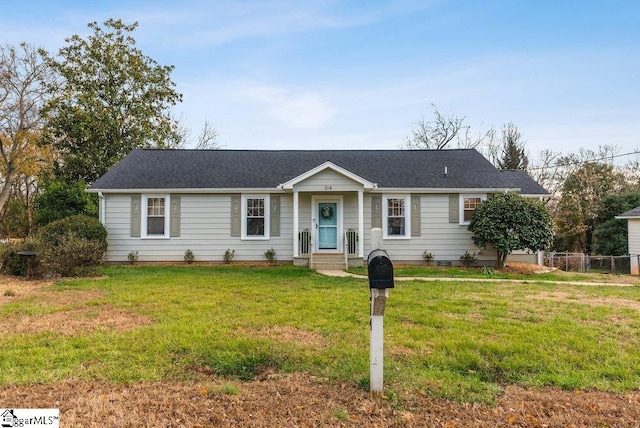 ranch-style home featuring a front yard