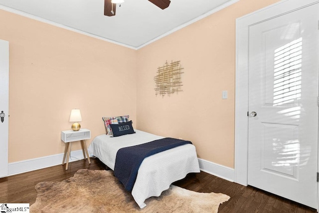 bedroom with ceiling fan, hardwood / wood-style floors, and ornamental molding