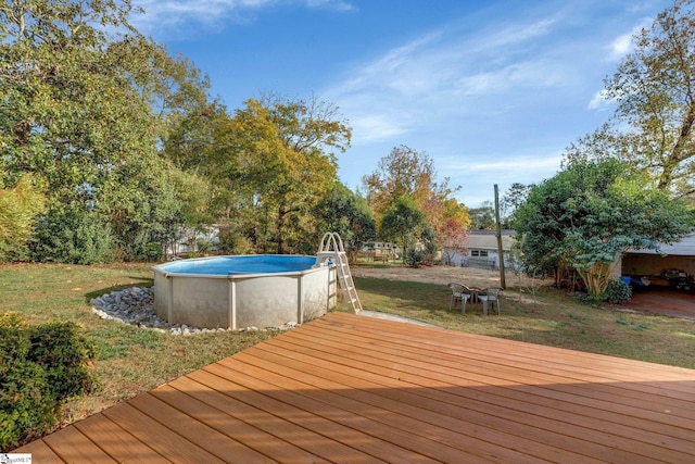 wooden deck with a lawn