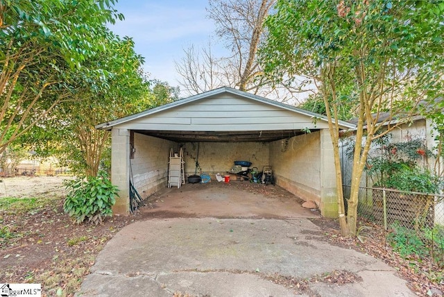 view of parking / parking lot with a carport