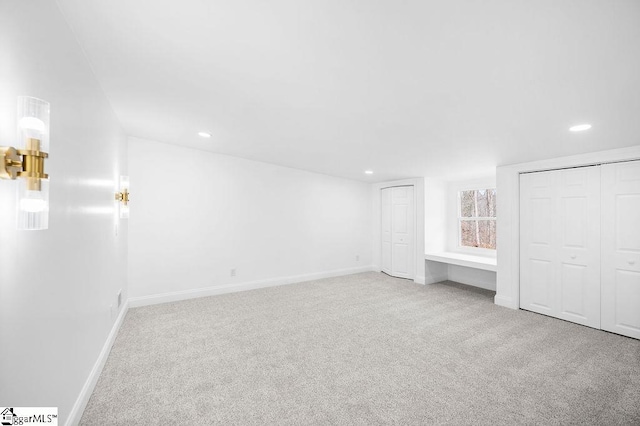 unfurnished bedroom with light carpet