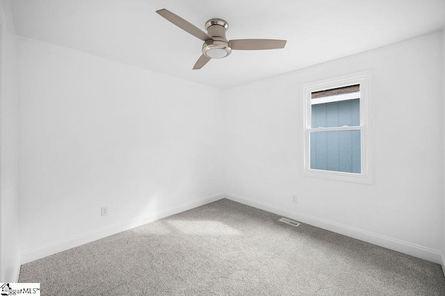 carpeted empty room with ceiling fan