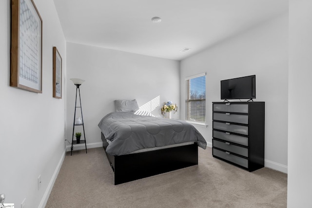 bedroom with light colored carpet