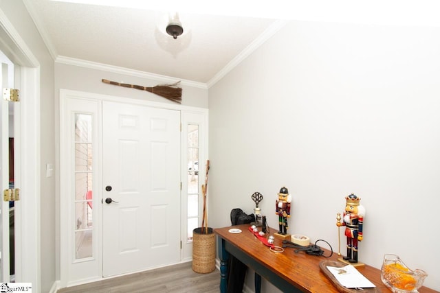 entryway featuring light hardwood / wood-style floors and ornamental molding