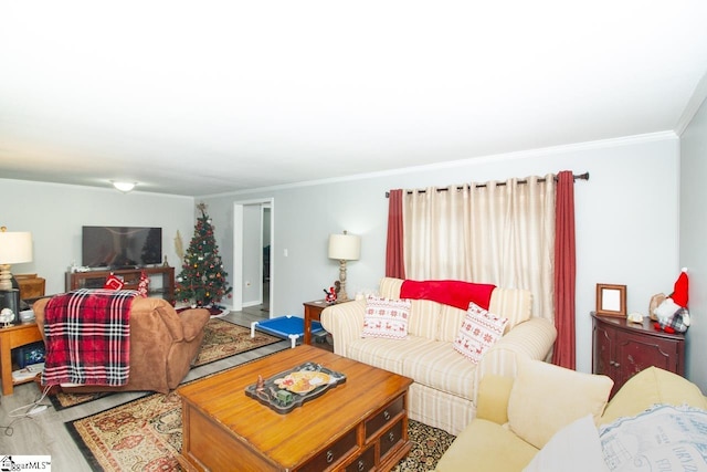 living room with ornamental molding and hardwood / wood-style flooring