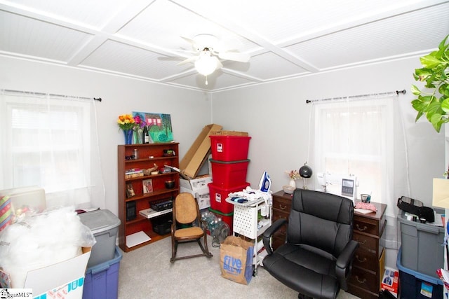 carpeted home office featuring ceiling fan