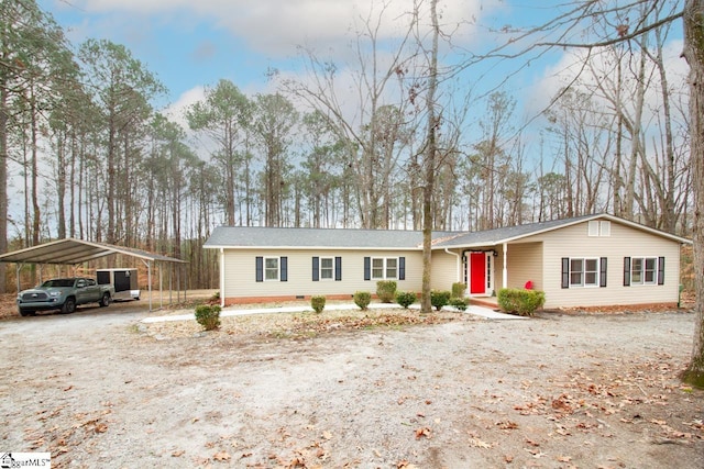 ranch-style house with a carport