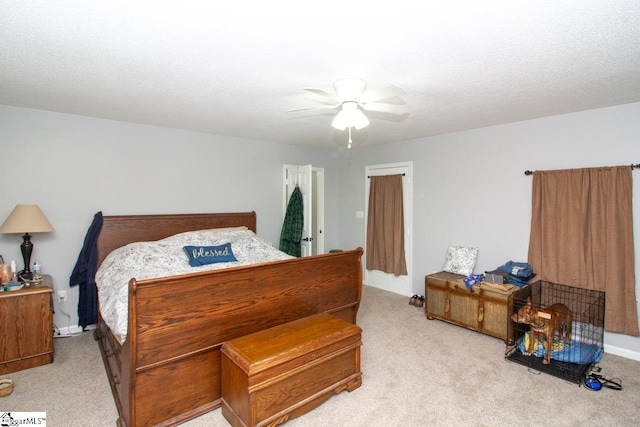 bedroom with ceiling fan and light colored carpet