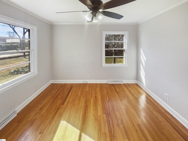 unfurnished room featuring a baseboard radiator, crown molding, and light hardwood / wood-style floors