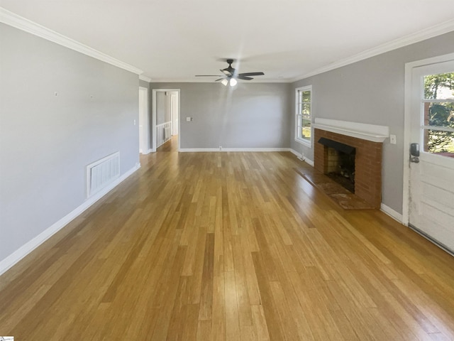 unfurnished living room featuring ceiling fan, light hardwood / wood-style floors, and ornamental molding