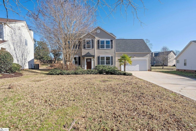 view of front of property with a front yard and a garage