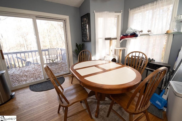 dining space with hardwood / wood-style flooring